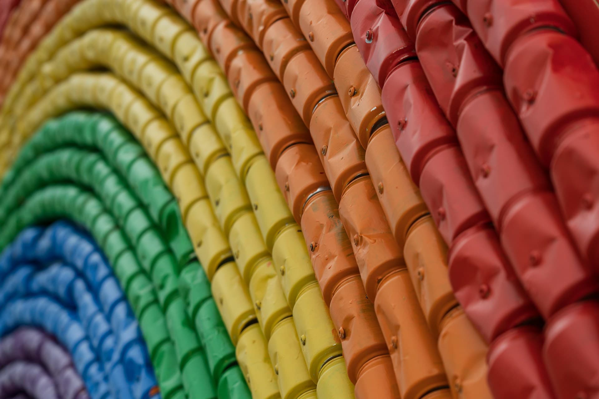 Recycled cans painted like the rainbow